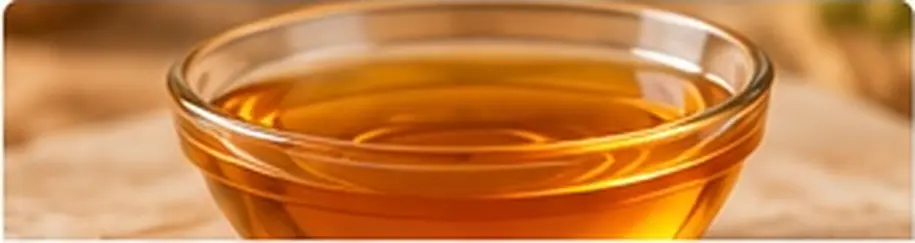 Light amber date liquid sugar in a glass bowl